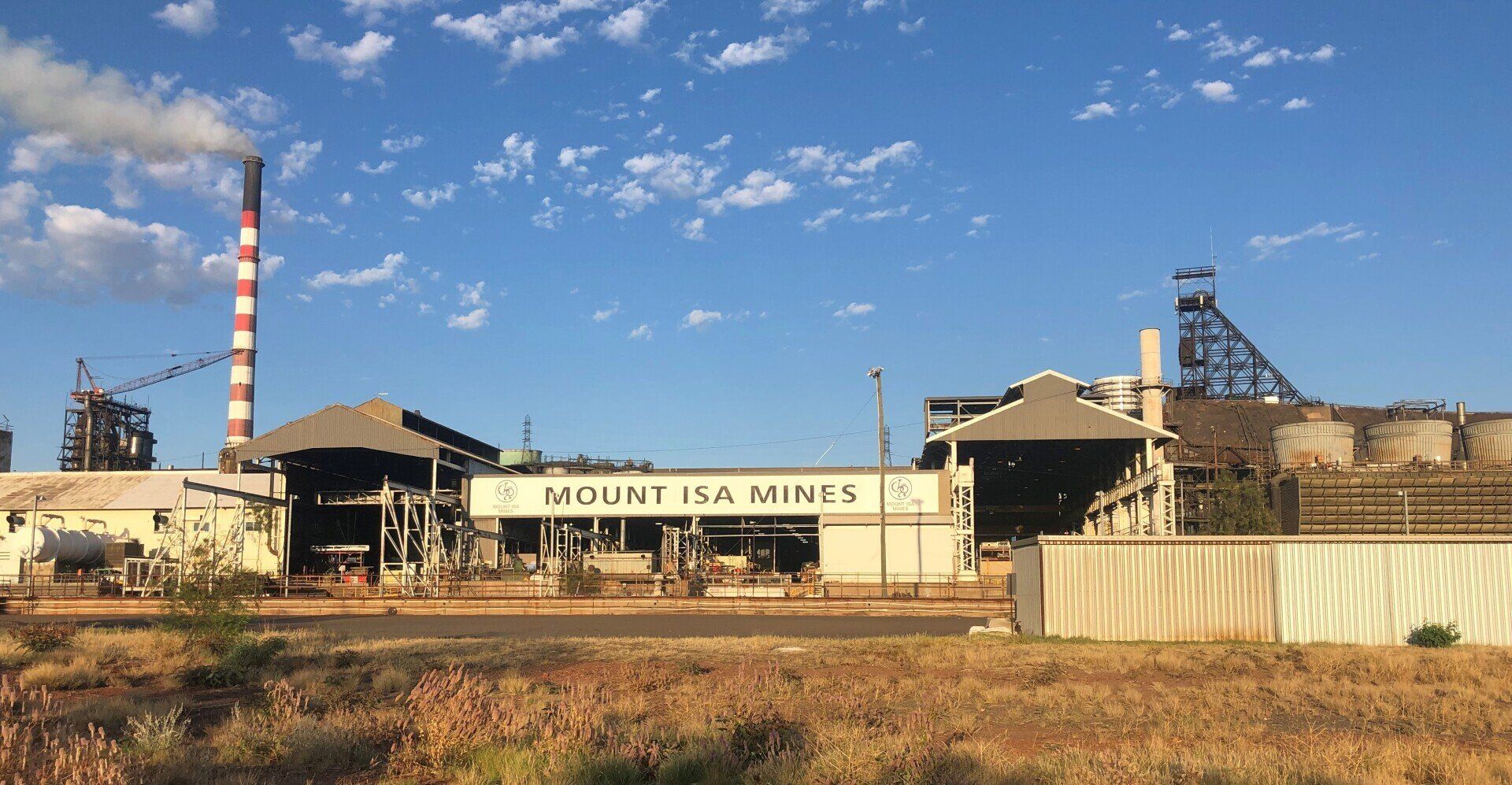 Large factory with chimney at a Mount Isa mine site painted by North West Queensland Painting
